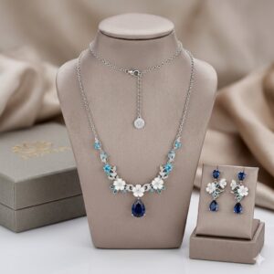 925 Sterling Silver Floral Jewelry Set with blue teardrop pendant and matching earrings.